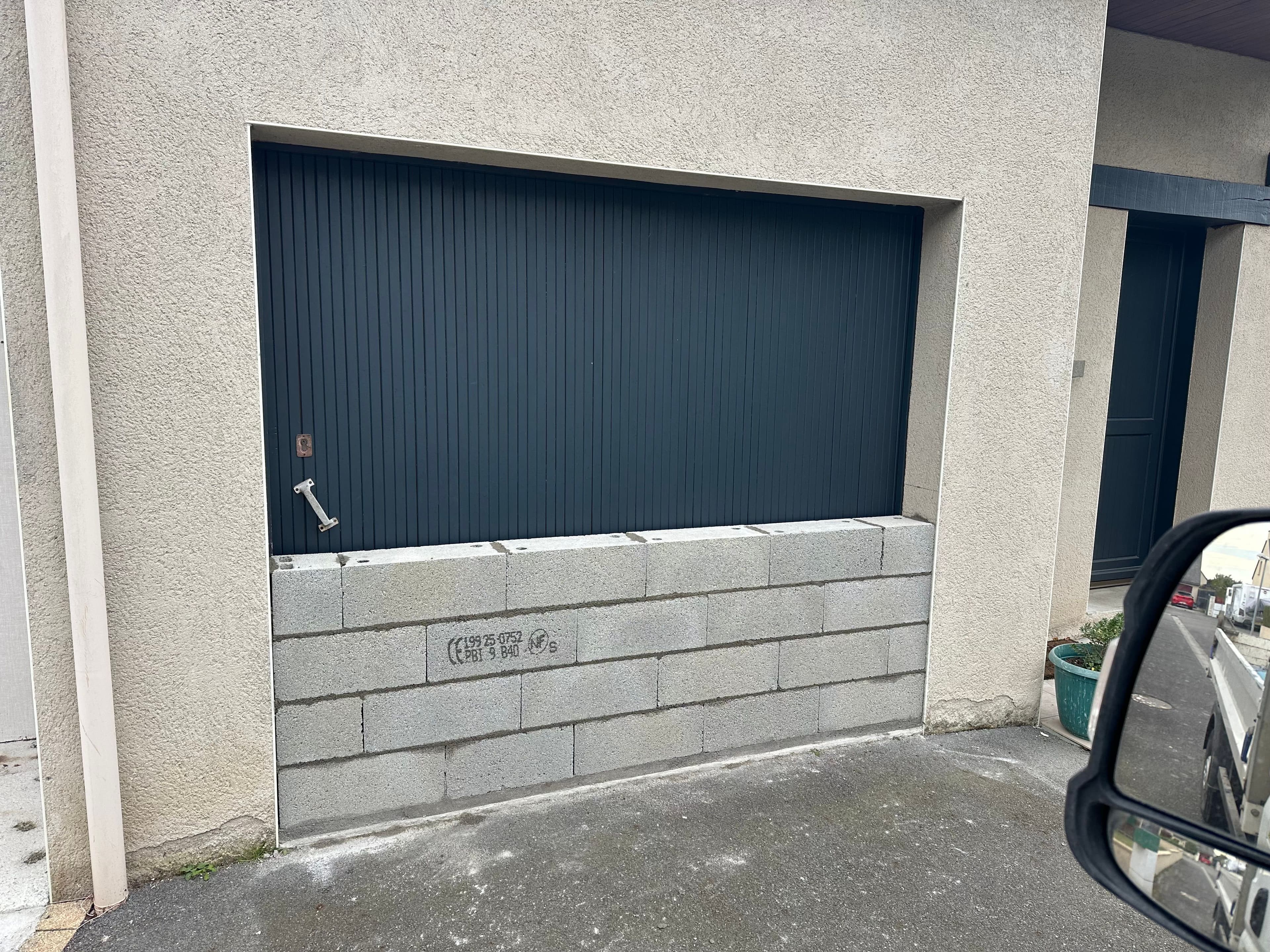 Fermeture d'un garage en habitation